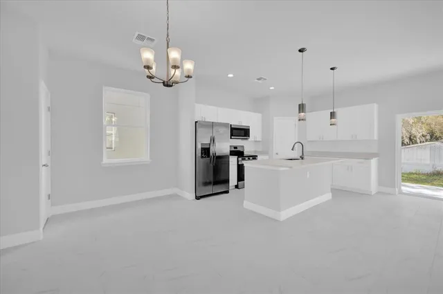 a view of a kitchen with a sink and dishwasher kitchen view