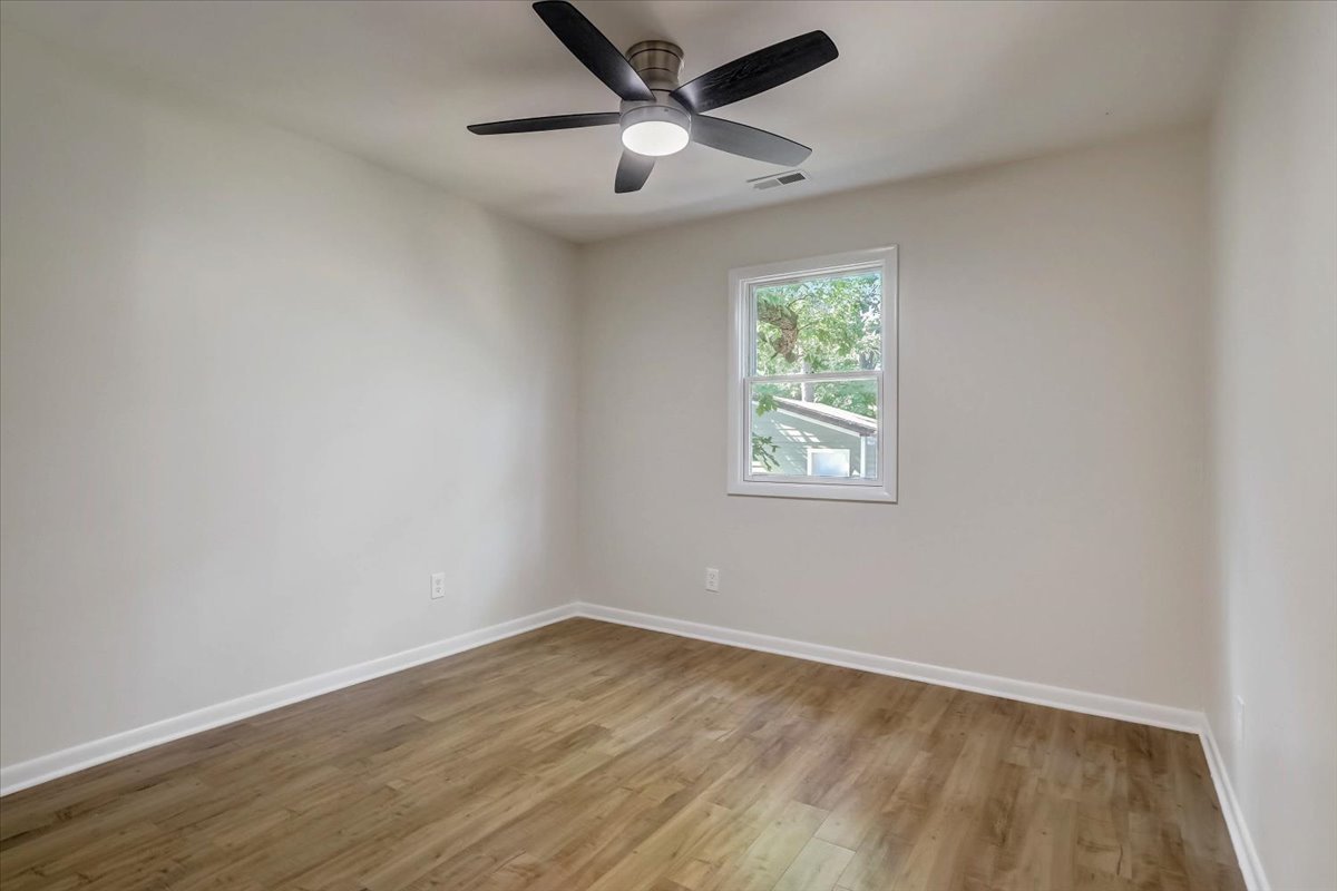 124 Hickory Road Lake In The Hills, IL 60156 - Photo 21 of 49 an empty room with wooden floor and windows