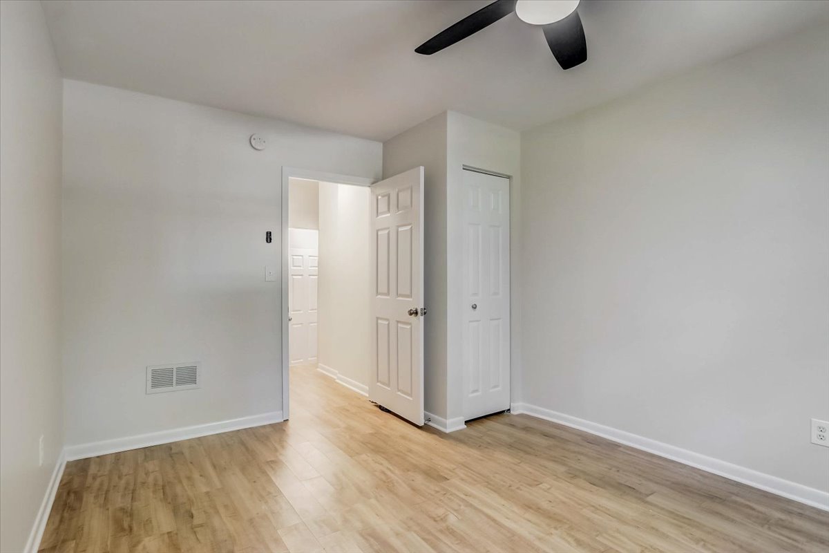 124 Hickory Road Lake In The Hills, IL 60156 - Photo 22 of 49 a view of empty room with wooden floor