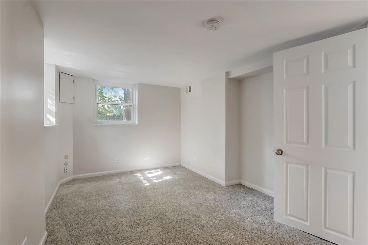124 Hickory Road Lake In The Hills, IL 60156 - Photo 25 of 49 an empty room with windows
