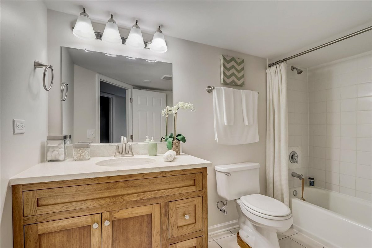 124 Hickory Road Lake In The Hills, IL 60156 - Photo 27 of 49 a bathroom with a sink vanity mirror and toilet
