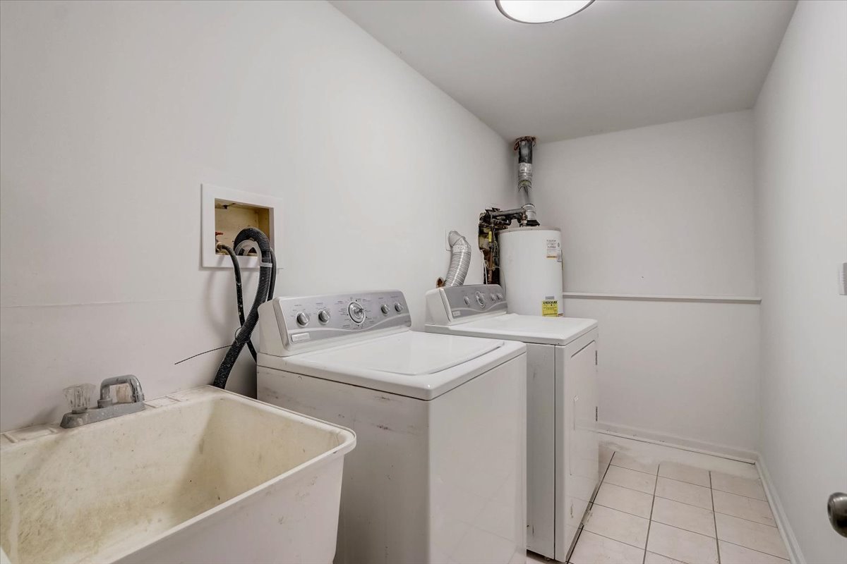 124 Hickory Road Lake In The Hills, IL 60156 - Photo 29 of 49 a bathroom with a sink and a tub
