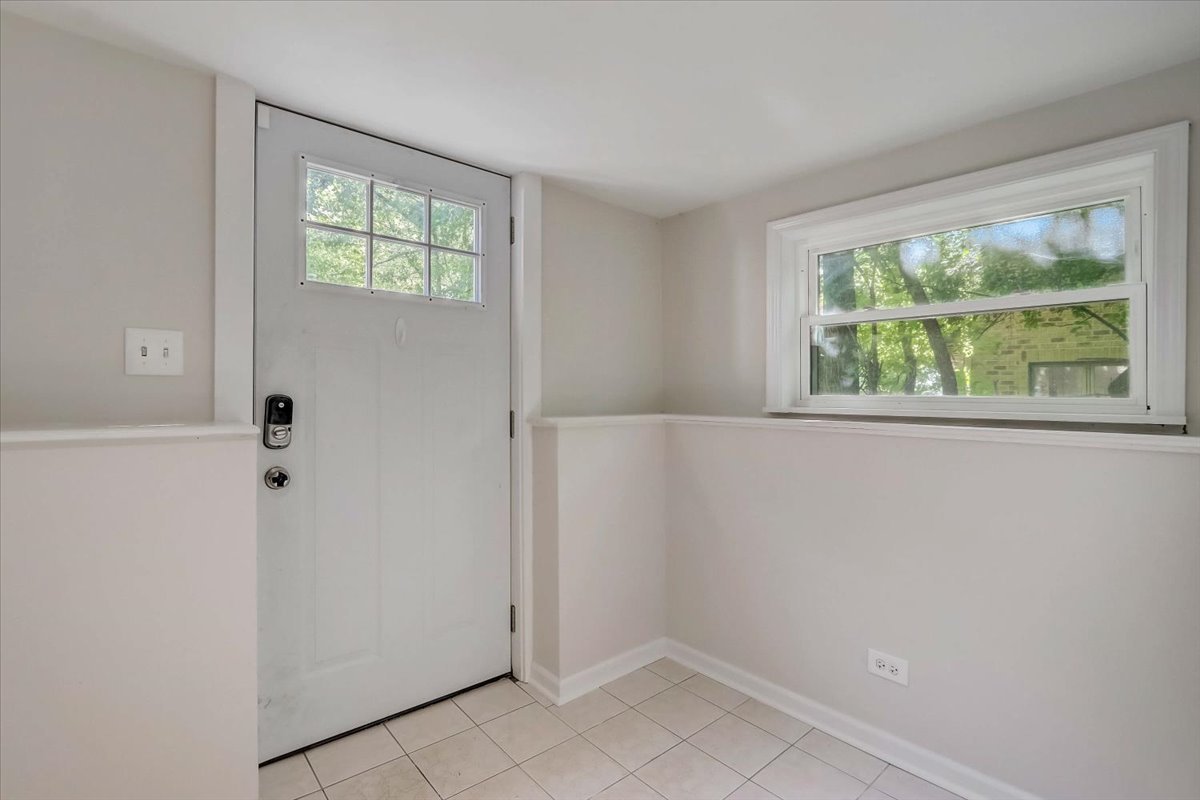 124 Hickory Road Lake In The Hills, IL 60156 - Photo 30 of 49 a view of an empty room with a window