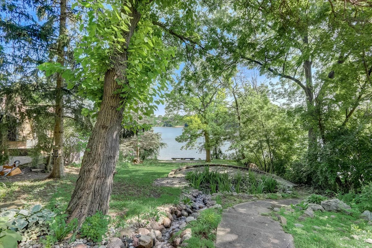124 Hickory Road Lake In The Hills, IL 60156 - Photo 38 of 49 a big yard with lots of green space and trees