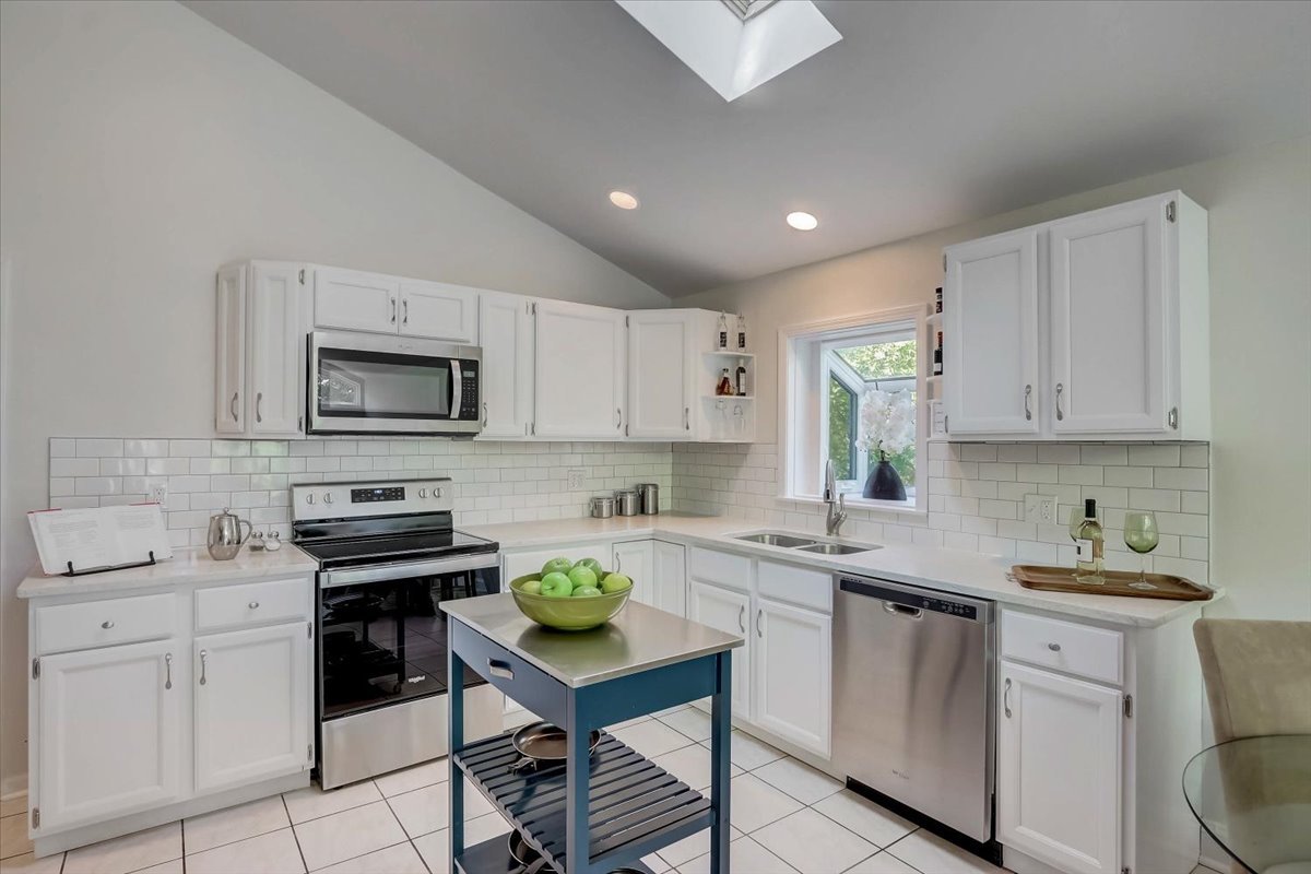 124 Hickory Road Lake In The Hills, IL 60156 - Photo 5 of 49 a kitchen with cabinets appliances and a sink