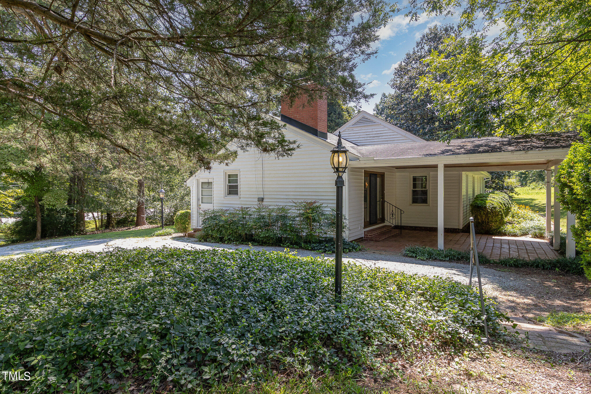 12423 North Roxboro Street Rougemont, NC 27572 - Photo 29 of 30 a view of a house with backyard and a tree