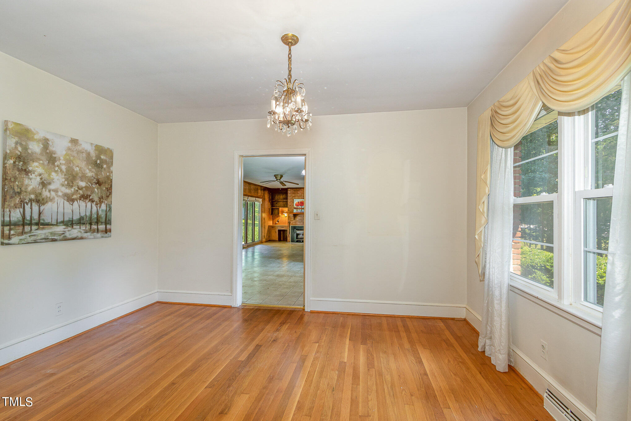 12423 North Roxboro Street Rougemont, NC 27572 - Photo 10 of 30 a view of empty room with wooden floor and window