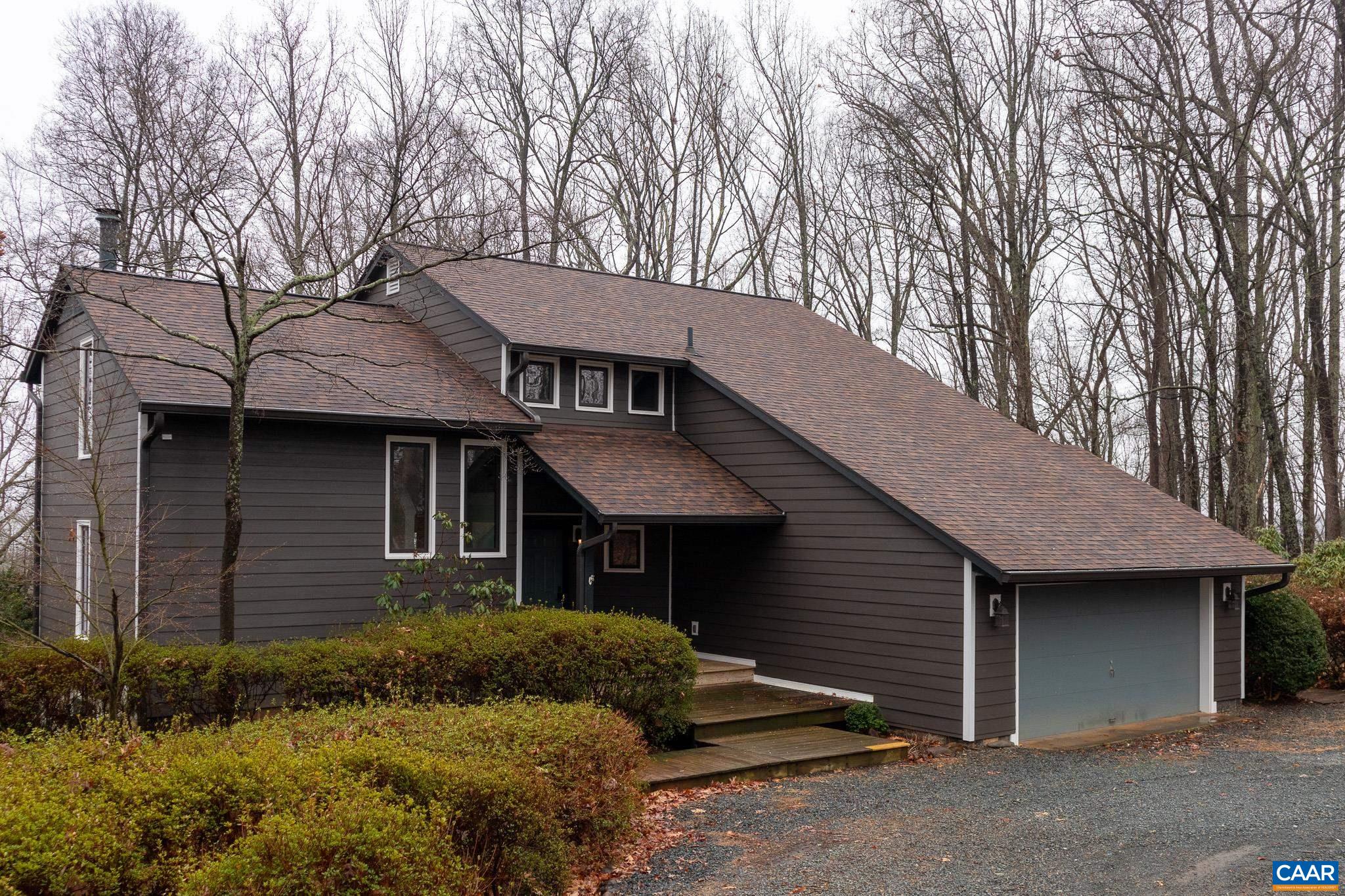 609 Dry Bridge Road Charlottesville, VA 22903 - Photo 1 of 3 a front view of a house with garden