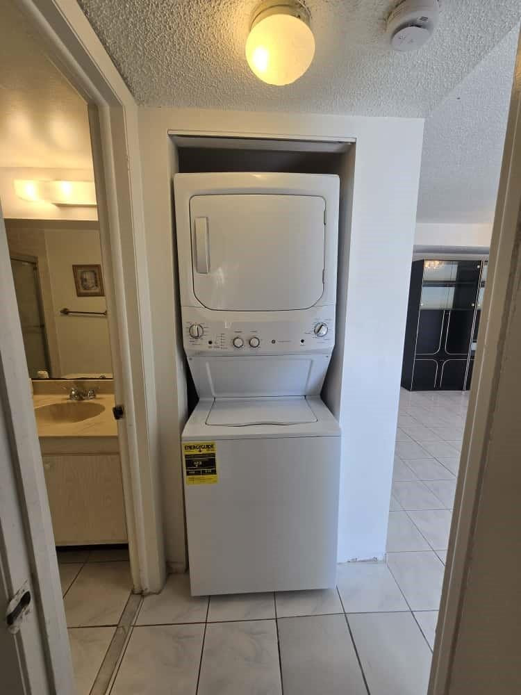 6195 Rock Island Road, Unit 209 Tamarac, FL 33319 - Photo 31 of 40 a utility room with dryer and washer