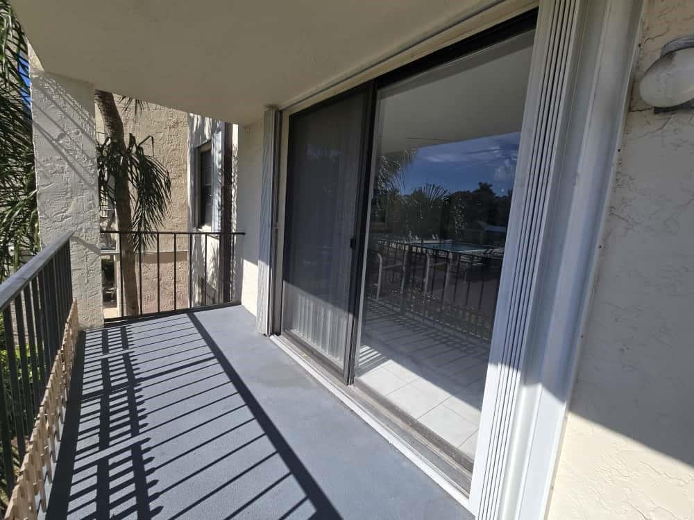 6195 Rock Island Road, Unit 209 Tamarac, FL 33319 - Photo 37 of 40 a view of balcony with wooden floor