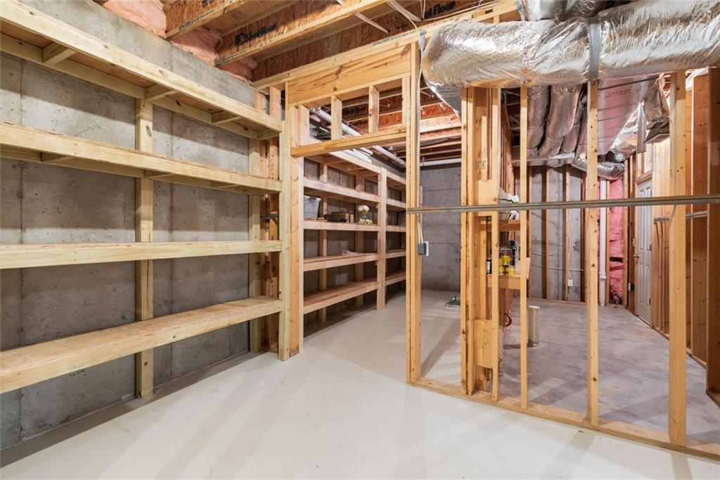 1450 Acworth Due West Road Northwest Kennesaw, GA 30152 - Photo 55 of 77 a view of walk in closet with empty racks