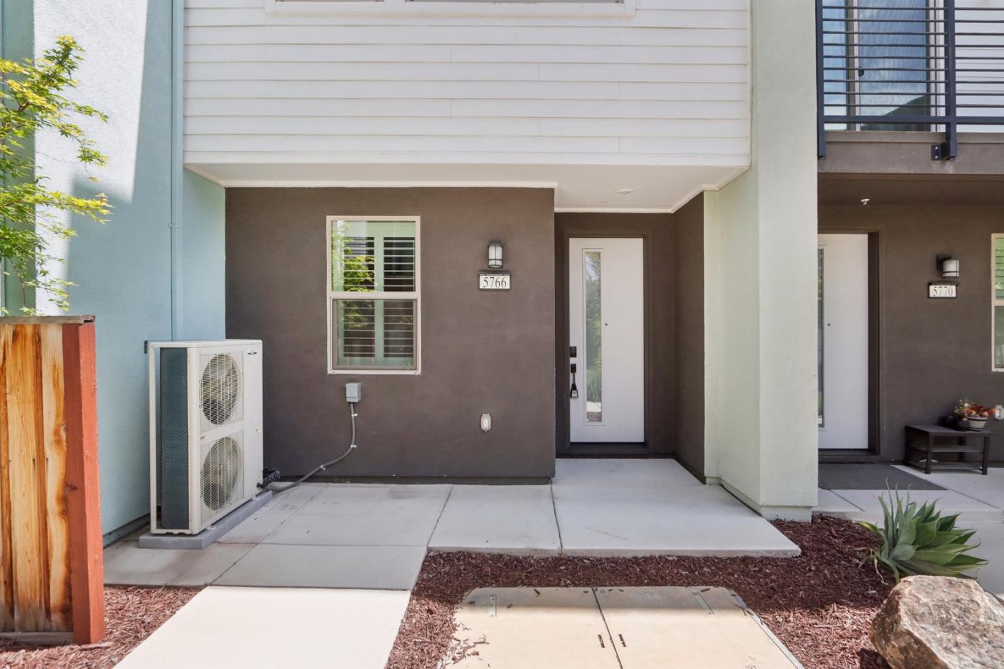 a view of a house with entryway and a street