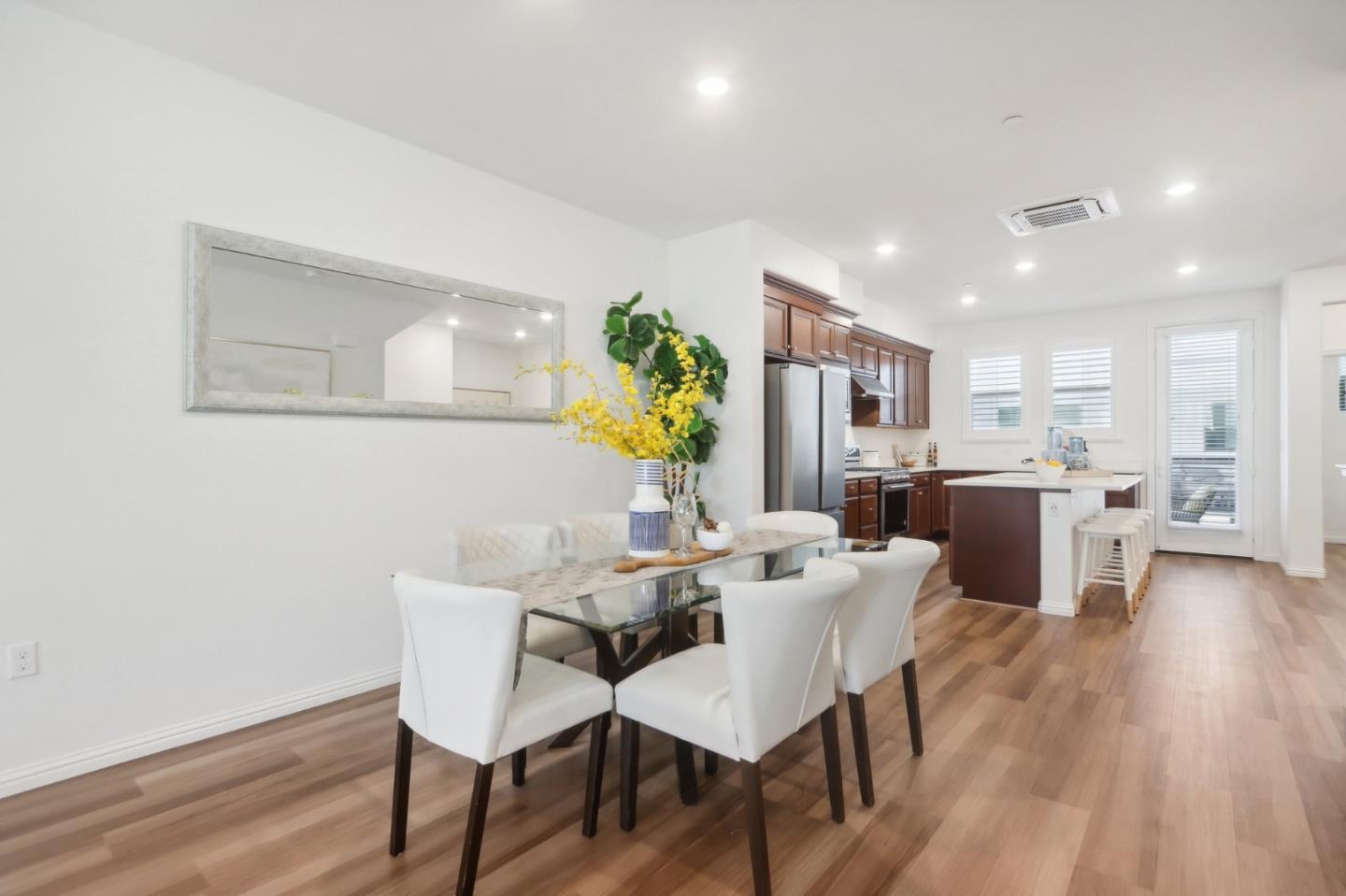 5766 Stealth Loop San Jose, CA 95119 - Photo 13 of 48 a view of a dining room with furniture and wooden floor