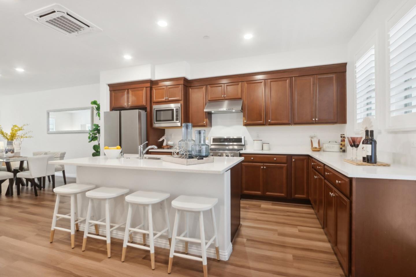 5766 Stealth Loop San Jose, CA 95119 - Photo 17 of 48 a kitchen with cabinets a sink dishwasher a stove and a refrigerator