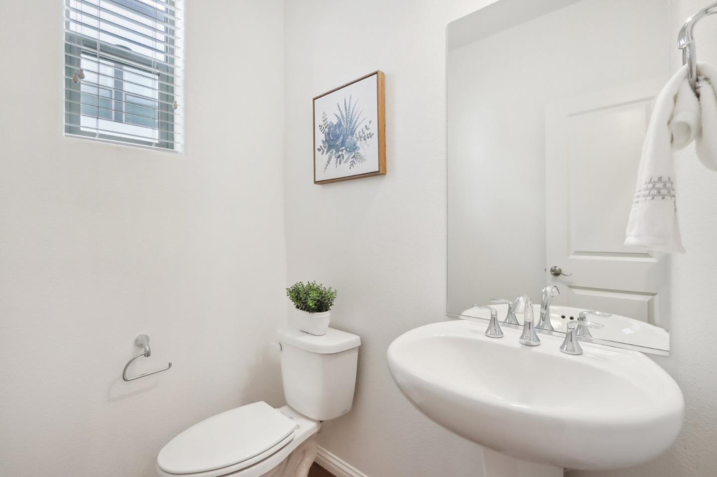 5766 Stealth Loop San Jose, CA 95119 - Photo 21 of 48 a bathroom with a toilet sink and mirror