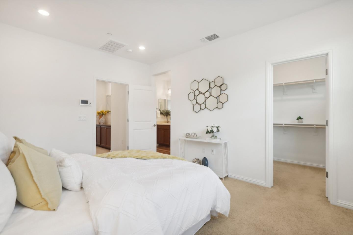 5766 Stealth Loop San Jose, CA 95119 - Photo 26 of 48 a bedroom with a bed and a table