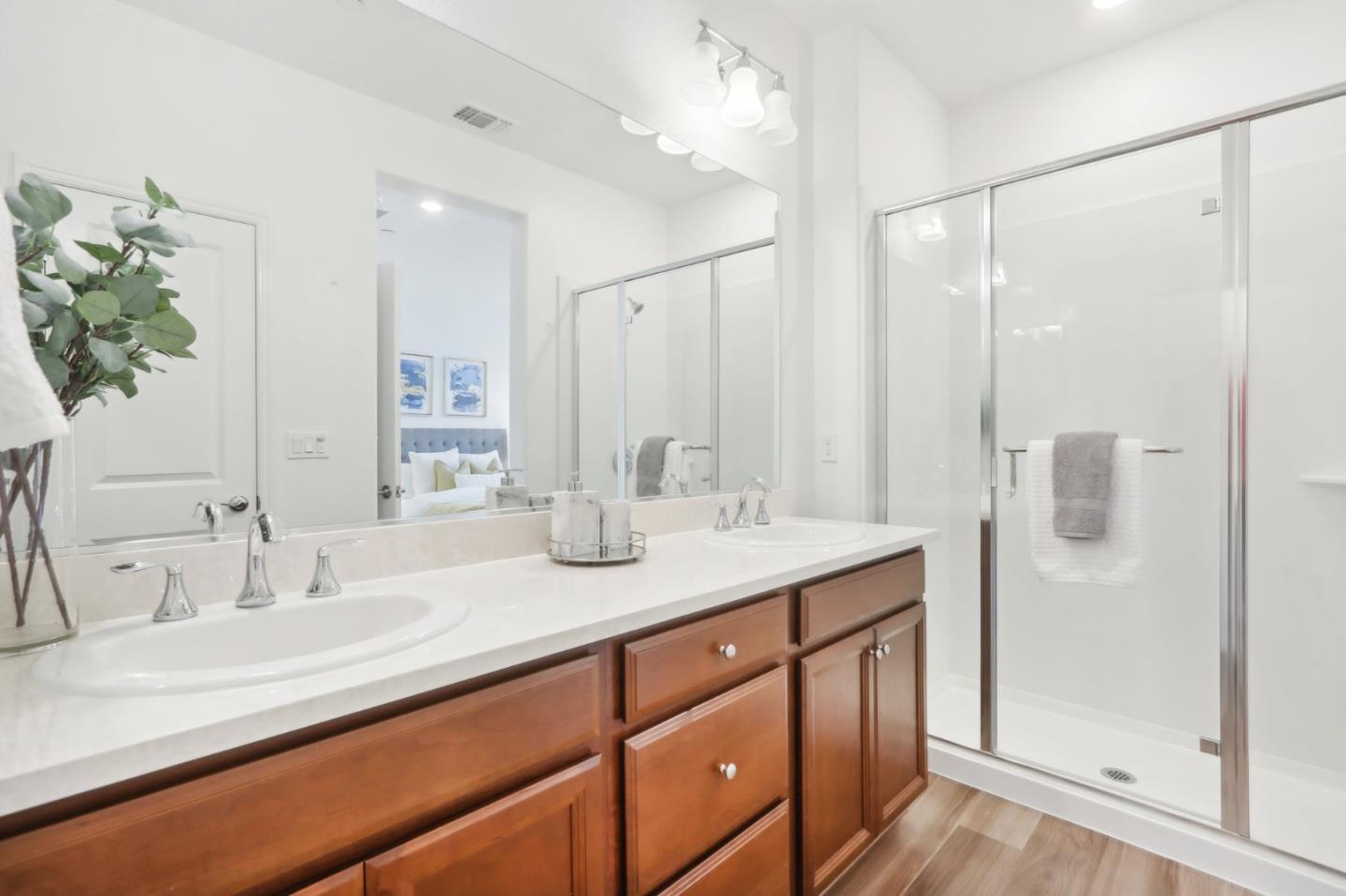5766 Stealth Loop San Jose, CA 95119 - Photo 27 of 48 a bathroom with a sink double vanity and a mirror