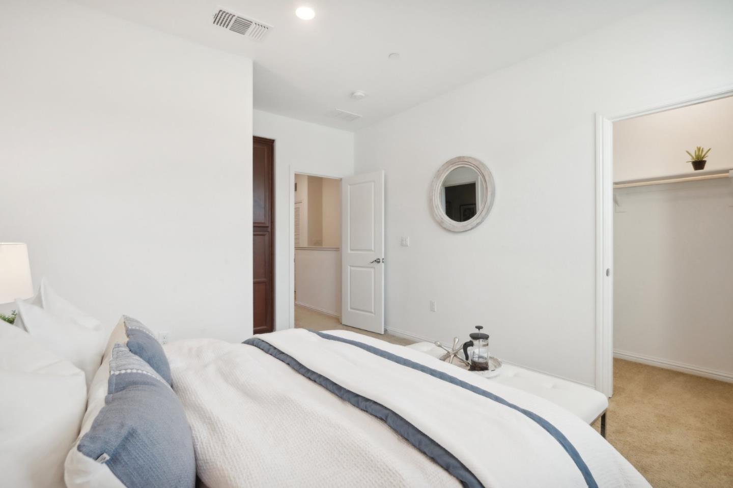 5766 Stealth Loop San Jose, CA 95119 - Photo 30 of 48 a bedroom with a bed and a window