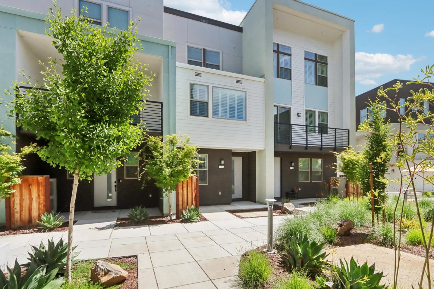 5766 Stealth Loop San Jose, CA 95119 - Photo 4 of 48 a view of a building with potted plants