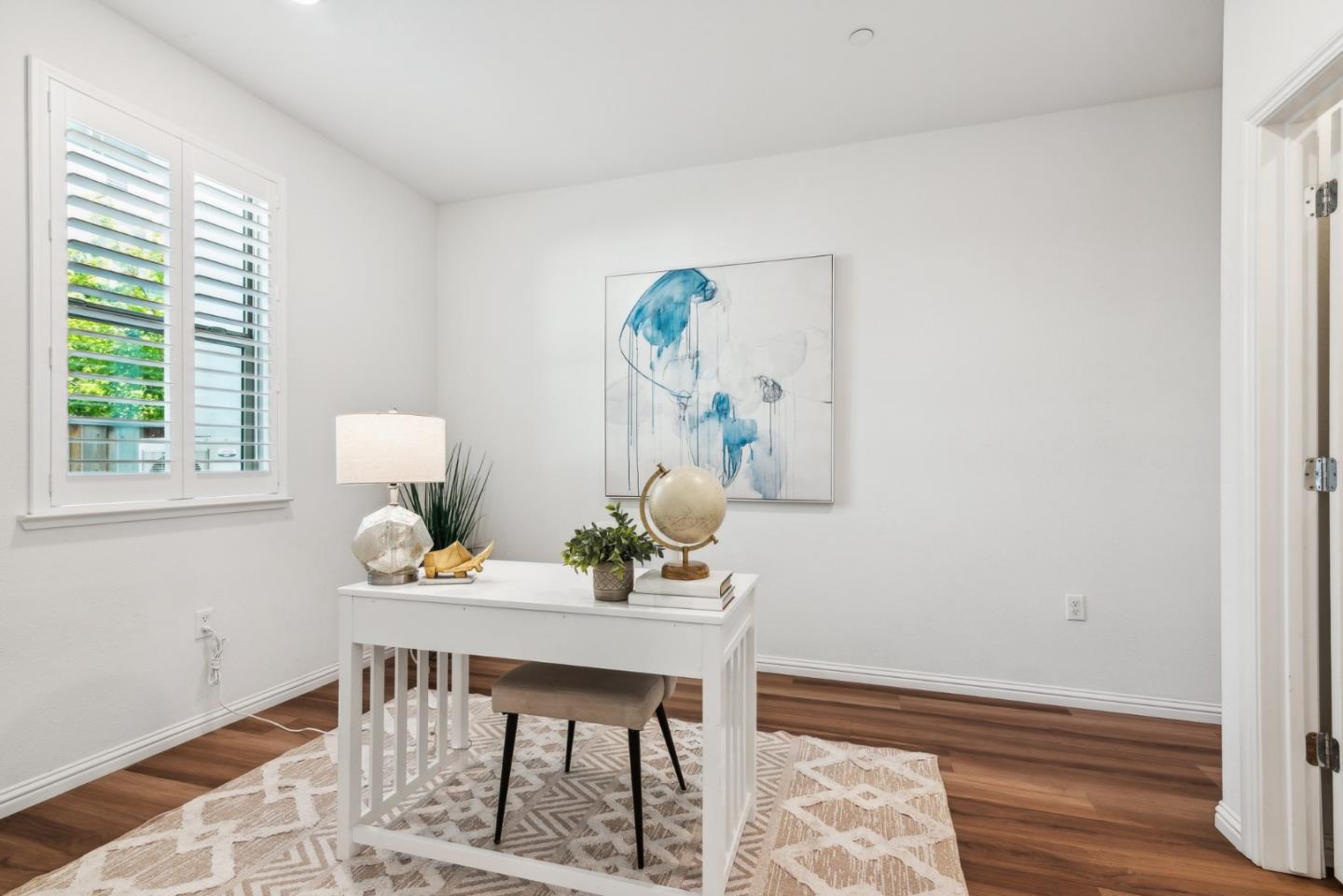 5766 Stealth Loop San Jose, CA 95119 - Photo 5 of 48 a dining room with furniture and wooden floor