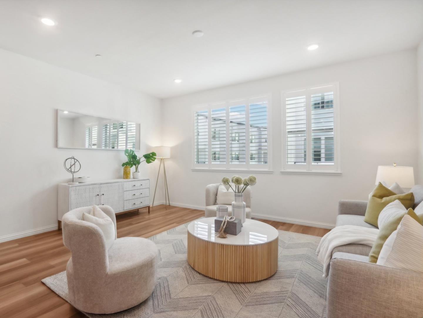 5766 Stealth Loop San Jose, CA 95119 - Photo 9 of 48 a living room with fireplace furniture and a wooden floor