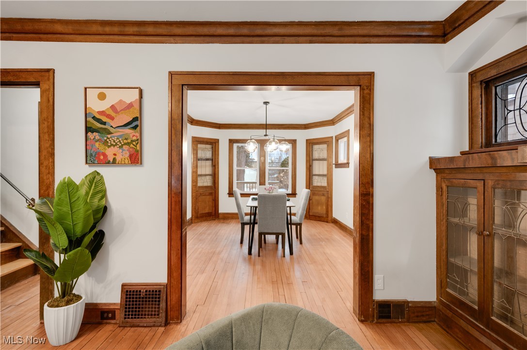 2016 Rossmoor Road Cleveland Heights, OH 44118 - Photo 12 of 46 Dining area with ornamental molding and light wood finished floors