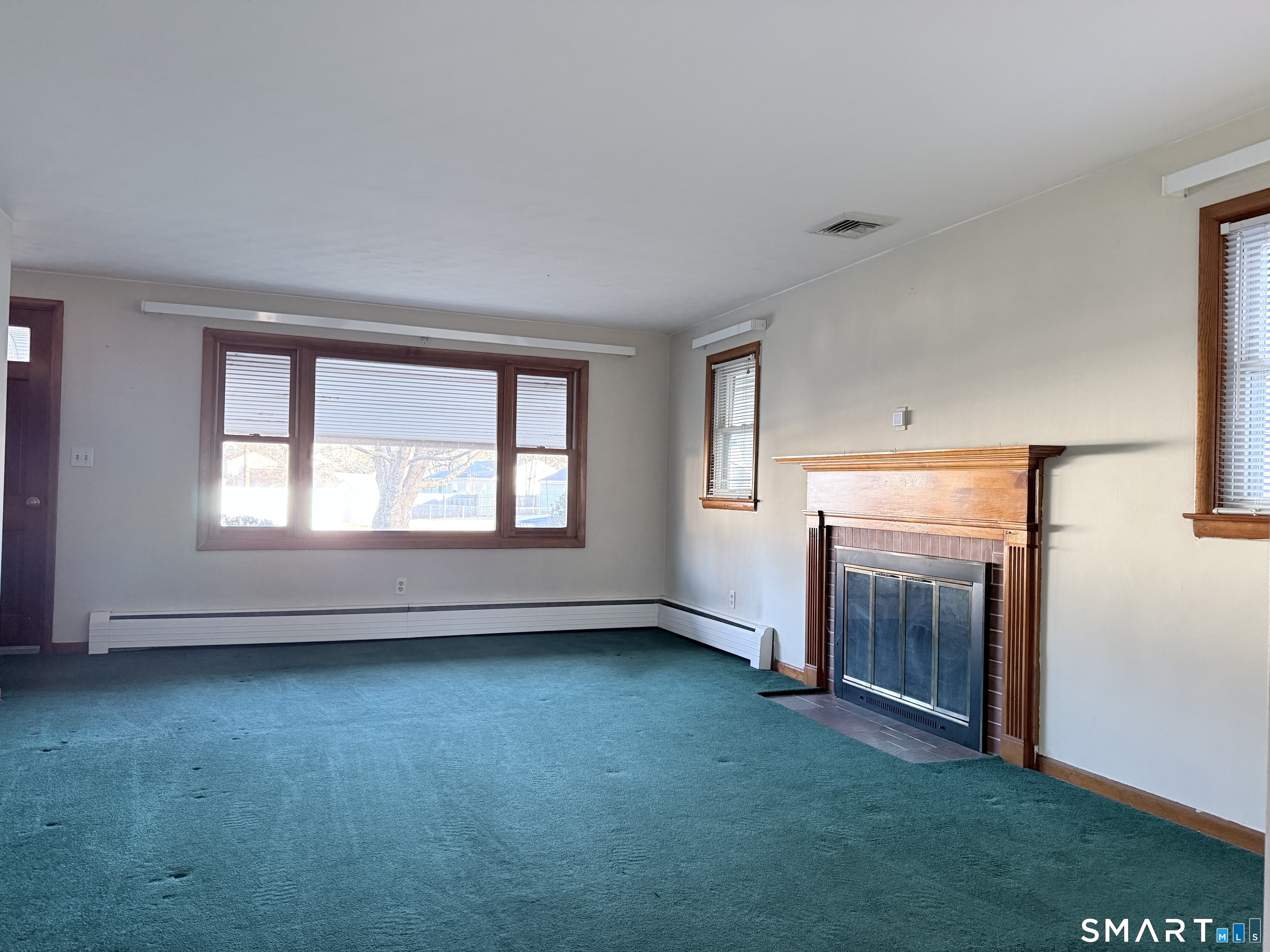 5 Edmund Lane Enfield, CT 06082 - Photo 4 of 11 an empty room with windows and closet