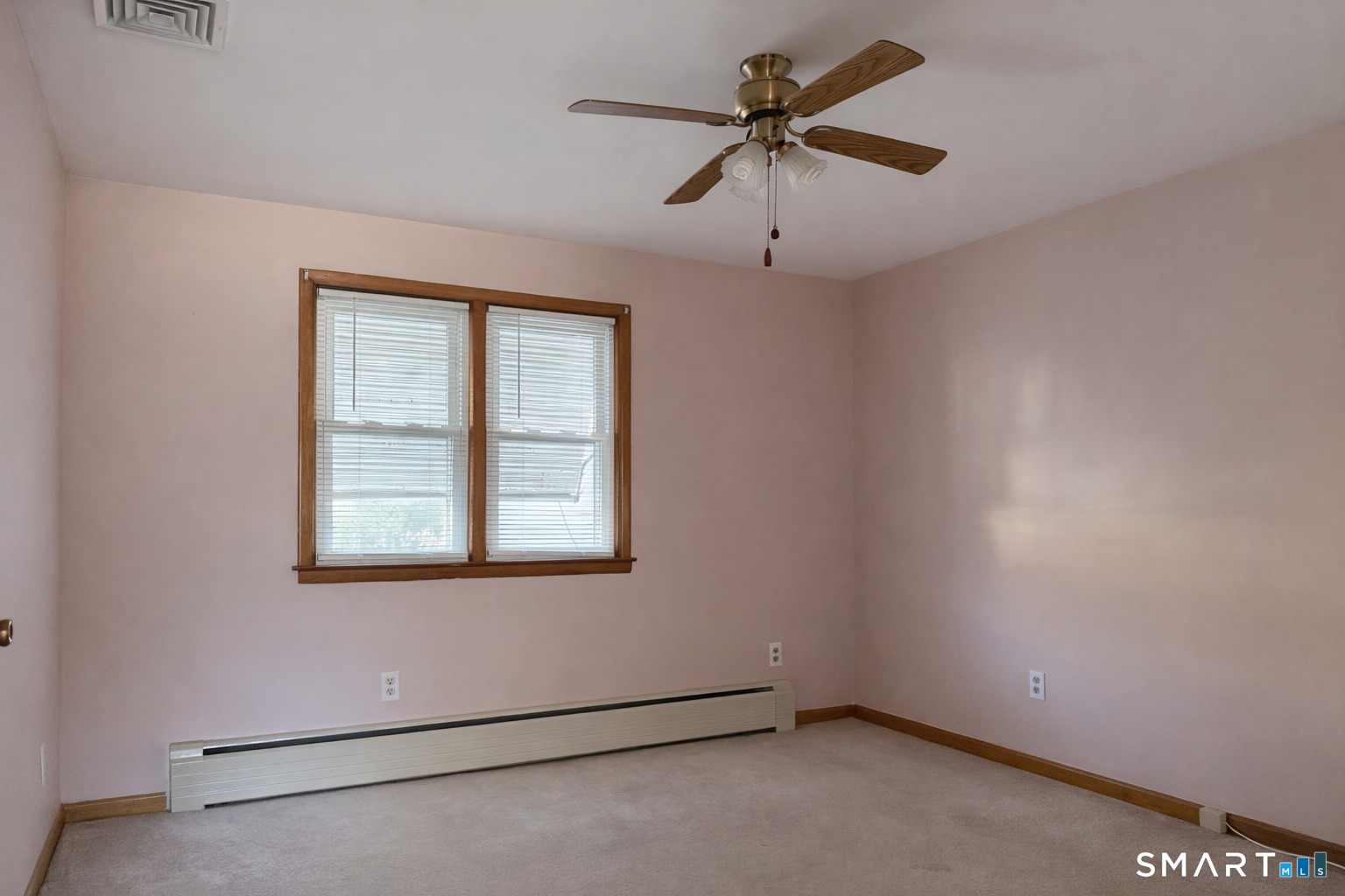 5 Edmund Lane Enfield, CT 06082 - Photo 7 of 11 an empty room with a window and a fan
