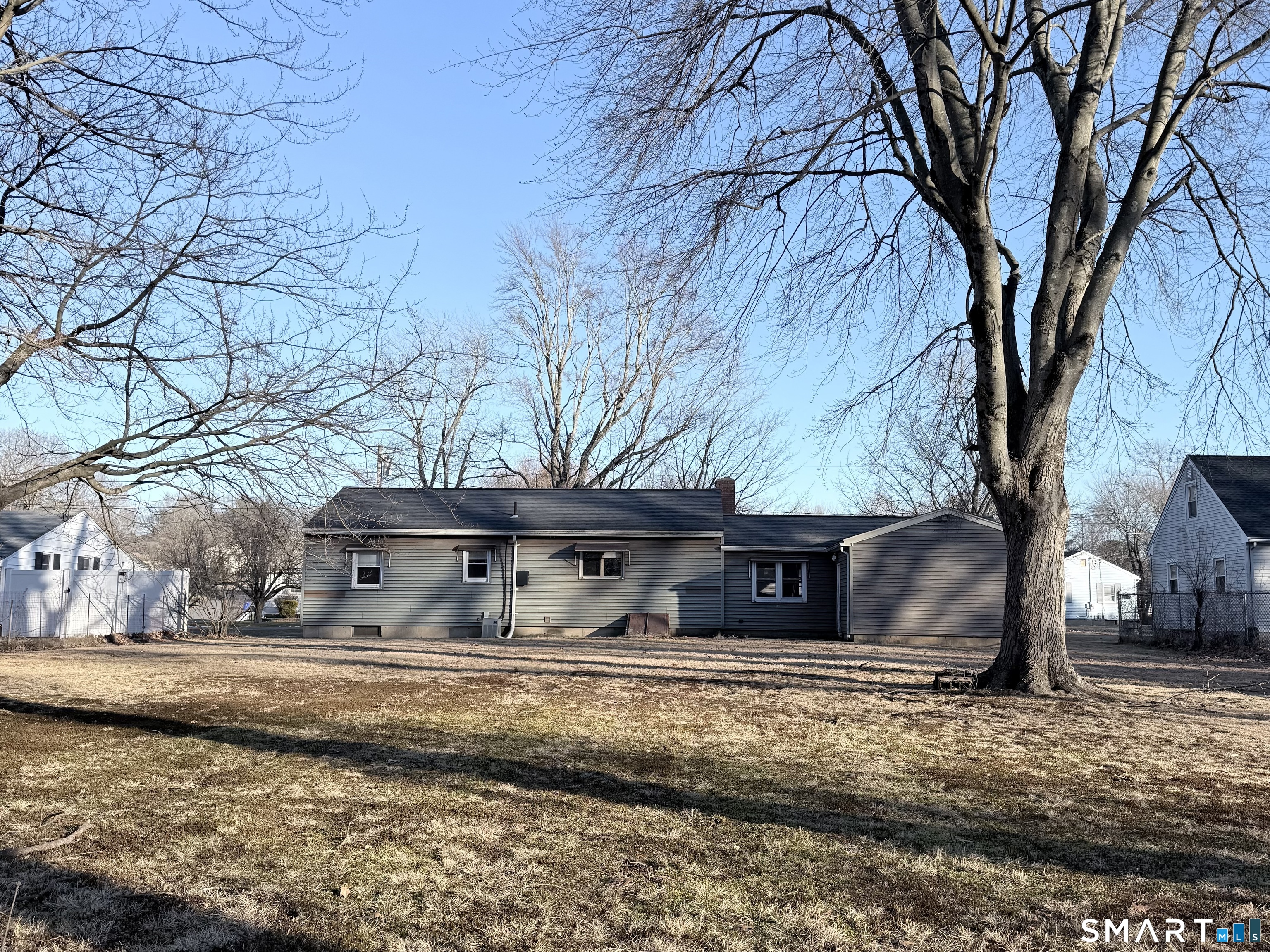 5 Edmund Lane Enfield, CT 06082 - Photo 10 of 11 a view of a house with a yard covered with snow