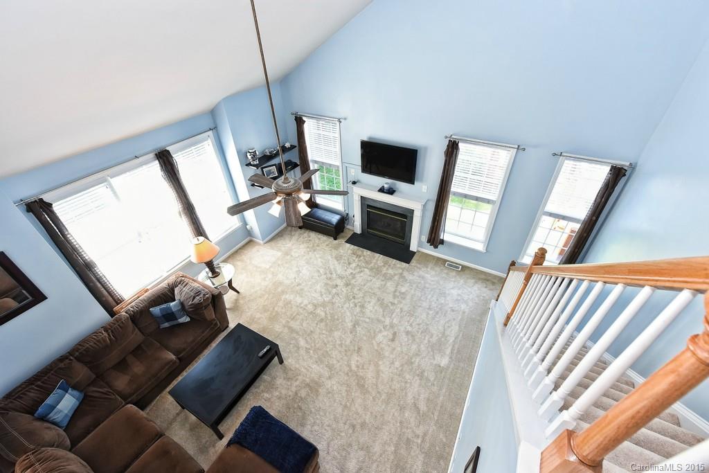 4719 Lapis Court Fort Mill, SC 29708 - Photo 13 of 24 a living room with furniture and a flat screen tv