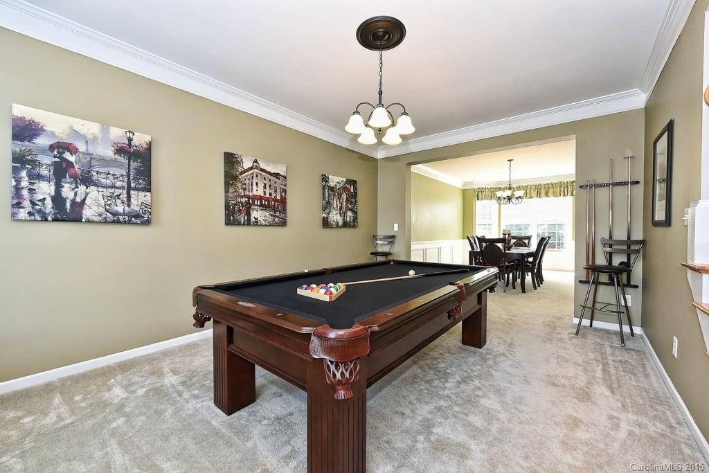 4719 Lapis Court Fort Mill, SC 29708 - Photo 4 of 24 a room with pool table and a chandelier