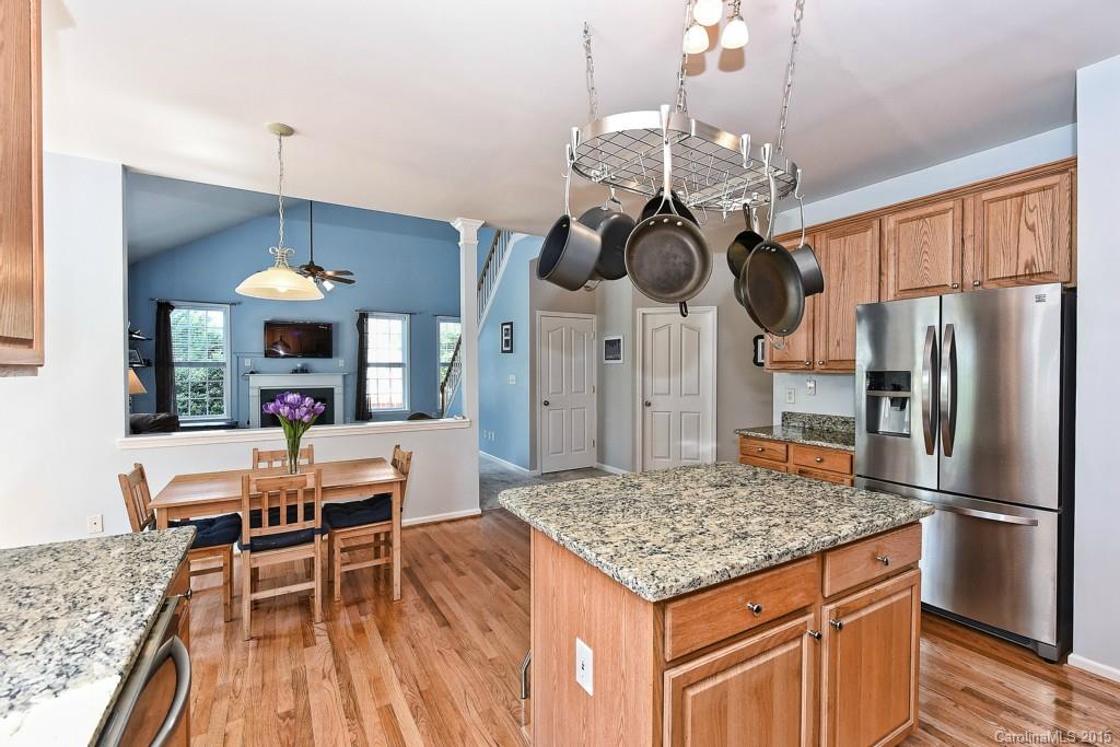 4719 Lapis Court Fort Mill, SC 29708 - Photo 9 of 24 a kitchen with stainless steel appliances granite countertop a stove oven and a refrigerator