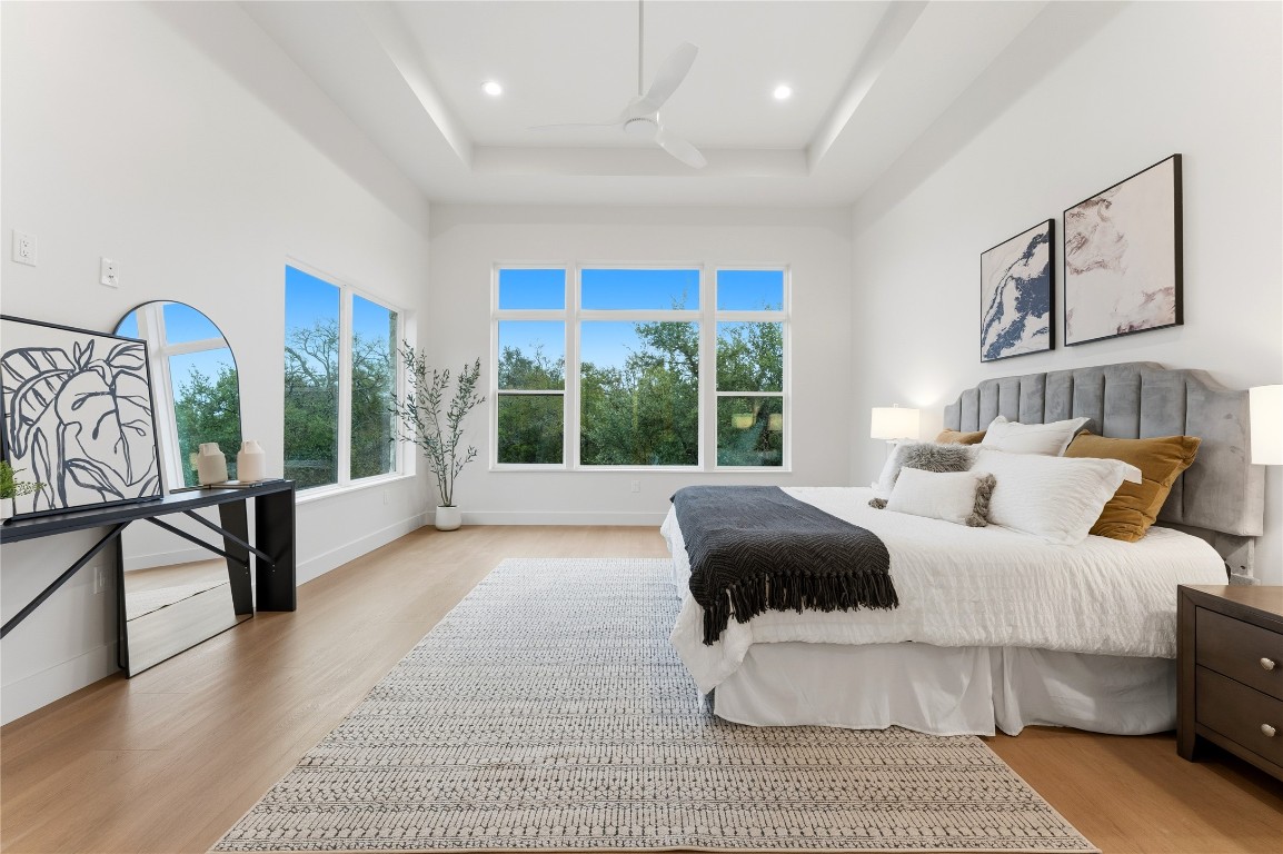 1283 Bunker Rnch Boulevard Dripping Springs, TX 78620 - Photo 9 of 22 a bedroom with furniture and a large window