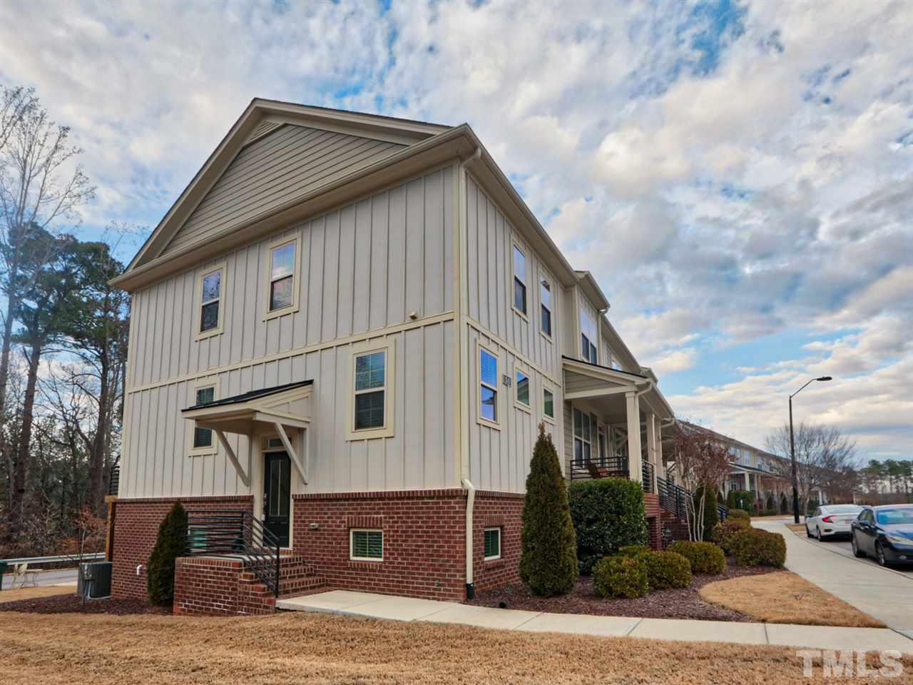 1543 Crafton Way Raleigh, NC 27607 - Photo 1 of 25 a front view of a house with garden
