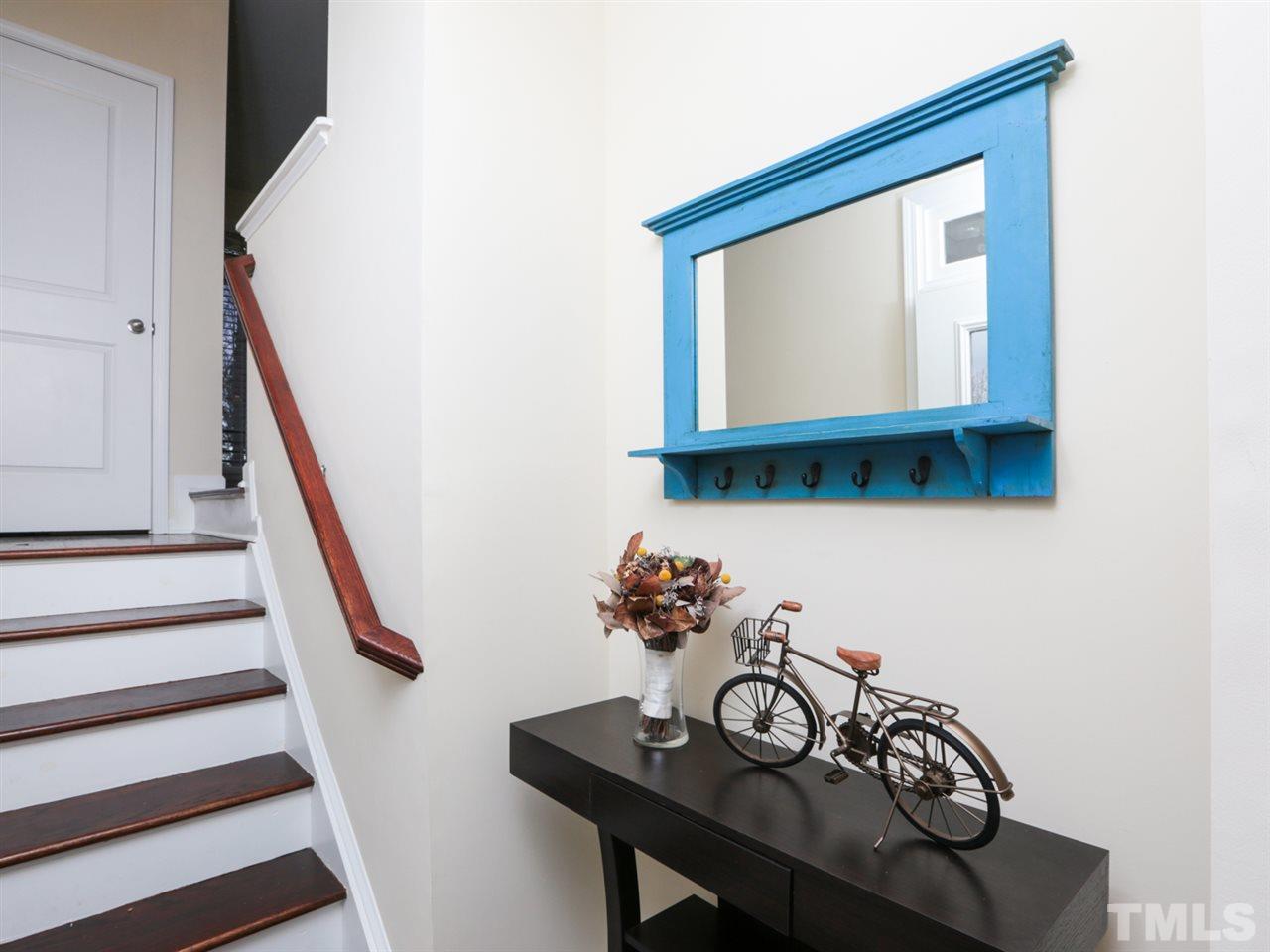 1543 Crafton Way Raleigh, NC 27607 - Photo 2 of 25 a view of a hallway with wooden floor and entryway