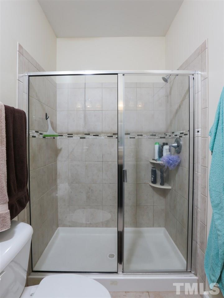 1543 Crafton Way Raleigh, NC 27607 - Photo 15 of 25 a bathroom with a shower