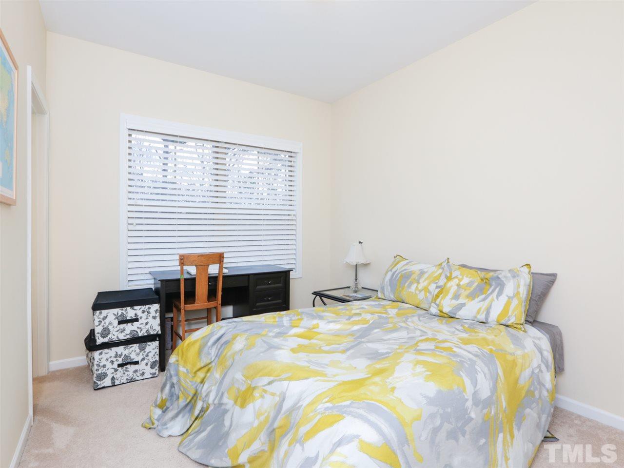 1543 Crafton Way Raleigh, NC 27607 - Photo 16 of 25 a bedroom with a bed and a closet