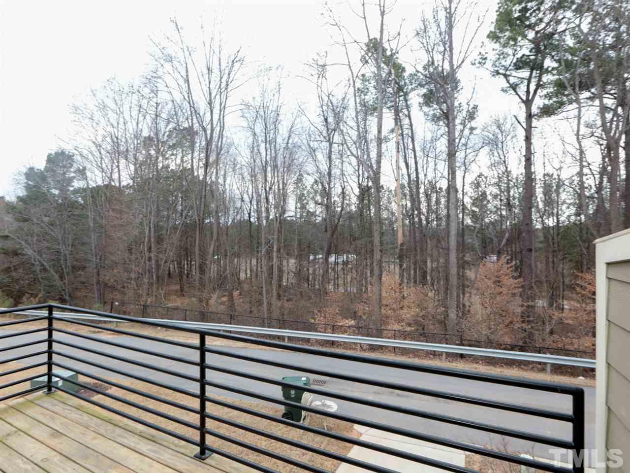 1543 Crafton Way Raleigh, NC 27607 - Photo 22 of 25 a view of a wooden fence with trees and wooden fence