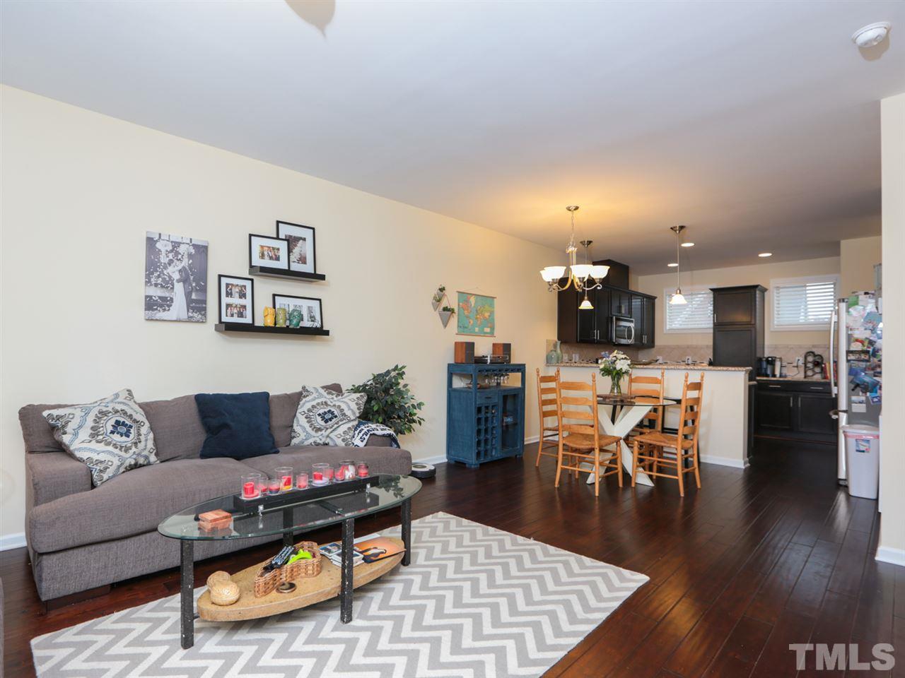 1543 Crafton Way Raleigh, NC 27607 - Photo 5 of 25 a living room with furniture and wooden floor