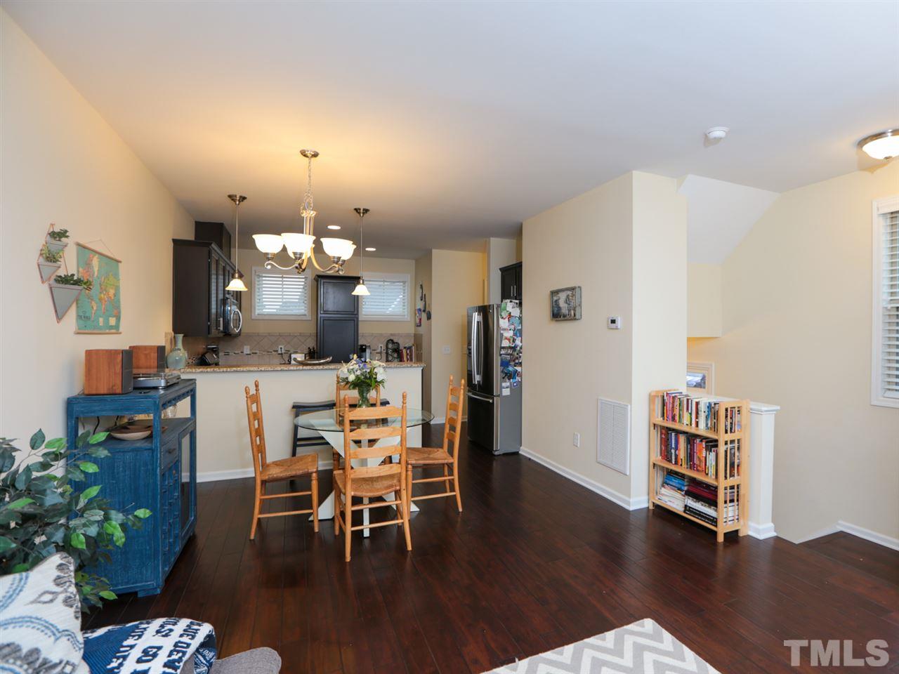 1543 Crafton Way Raleigh, NC 27607 - Photo 6 of 25 a view of a dining room with furniture and wooden floor