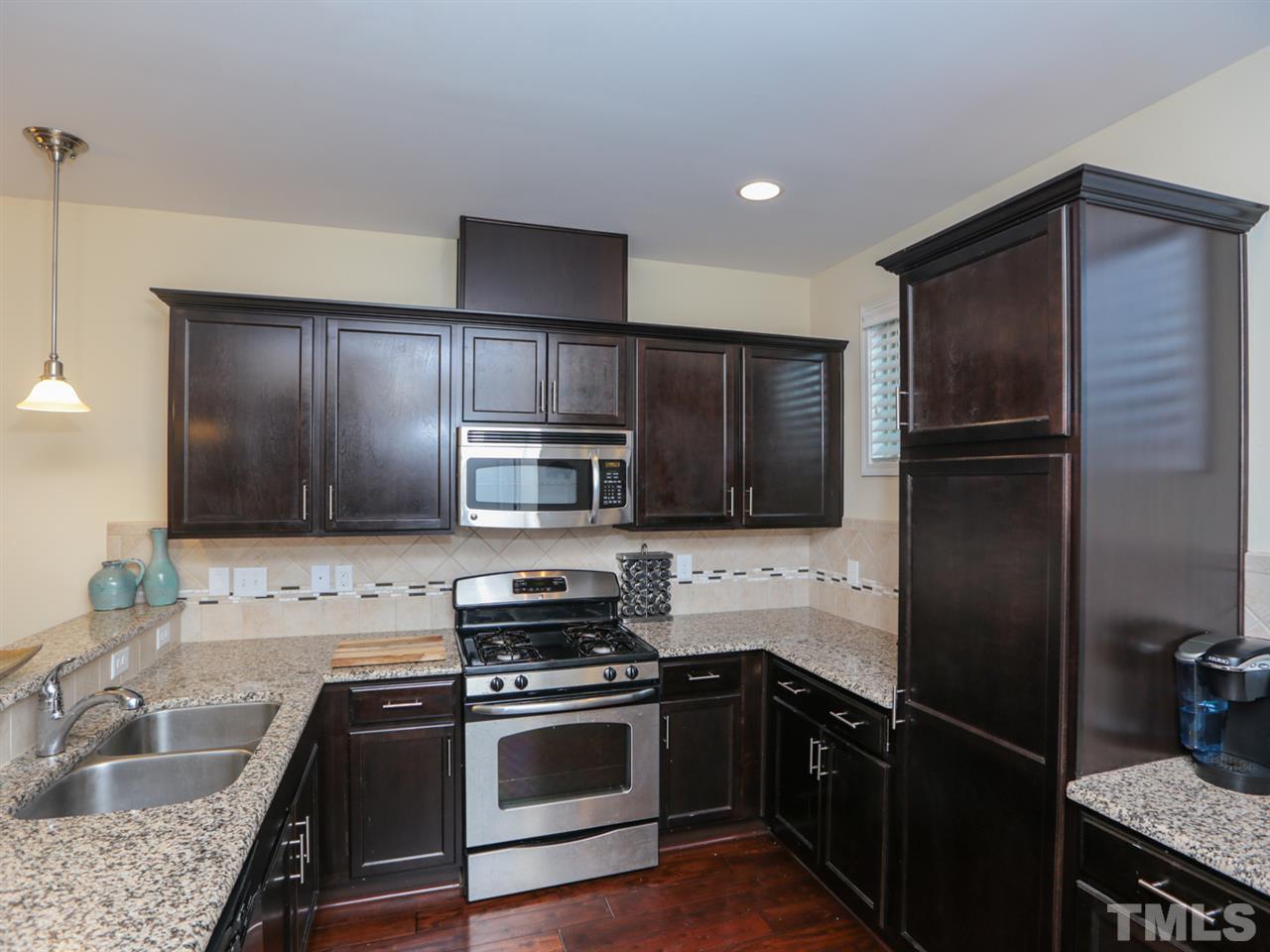 1543 Crafton Way Raleigh, NC 27607 - Photo 10 of 25 a kitchen with a refrigerator sink and microwave