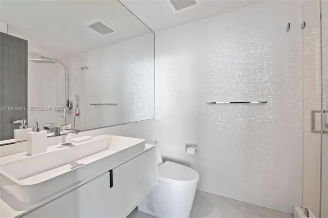 a bathroom with a sink toilet and vanity