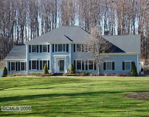 5 Copper Beech Lane Ridgefield, CT 06877 - Photo 1 of 1 a front view of a house with a garden