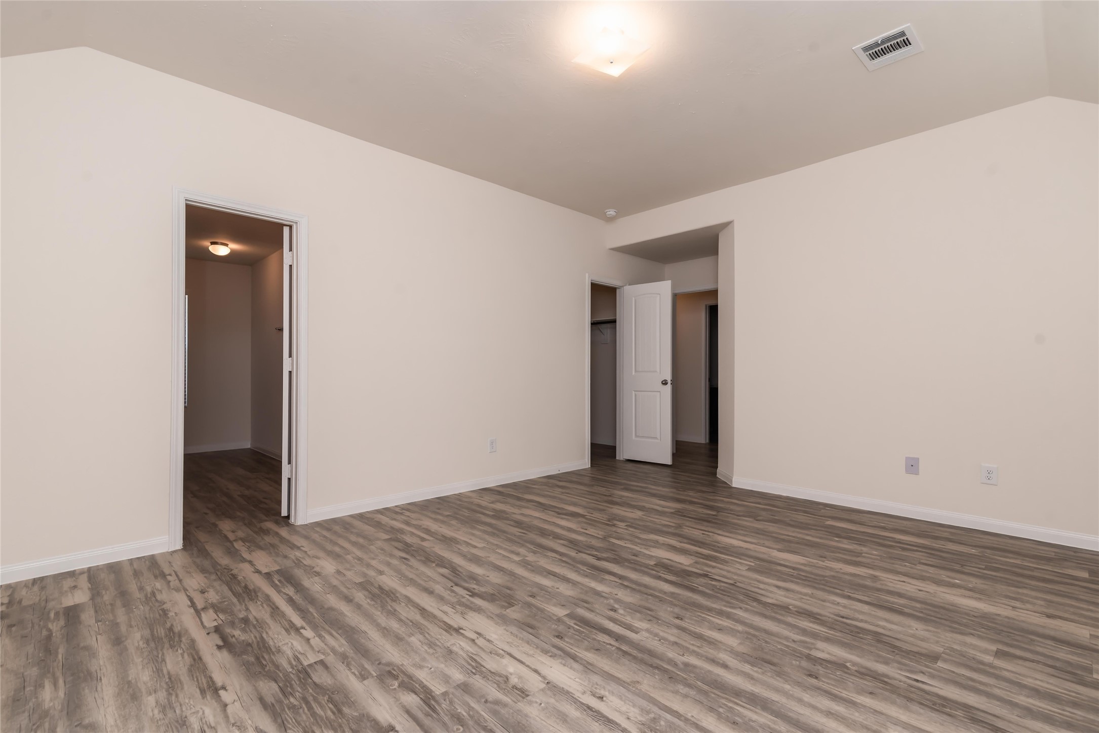 24322 Amaldi Court Katy, TX 77493 - Photo 5 of 8 a view of an empty room with wooden floor and closet