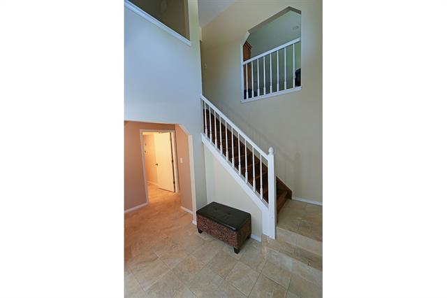 3123 Springdowns Place Colorado Springs, CO 80906 - Photo 6 of 36 2 story entry and mud room with new tile floors and easy access to the garage and laundry.
