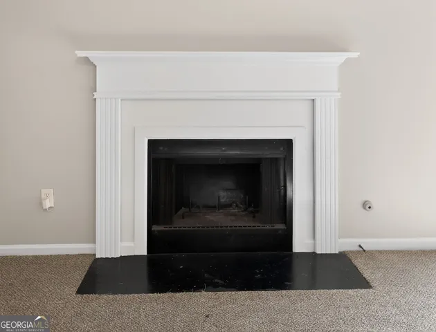 a living room with a fireplace