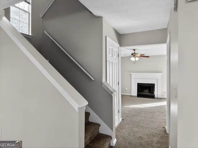 a view of a livingroom with an empty space and a fireplace