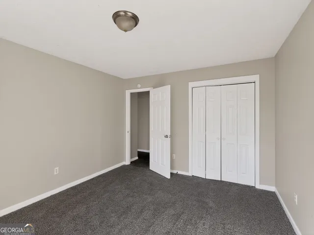 a view of an empty room and a window