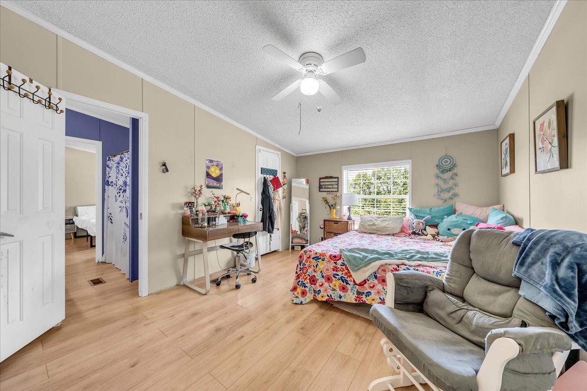 2657 Oak Grove Road Red Boiling Springs, TN 37150 - Photo 29 of 45 a bedroom with a bed and wooden floor