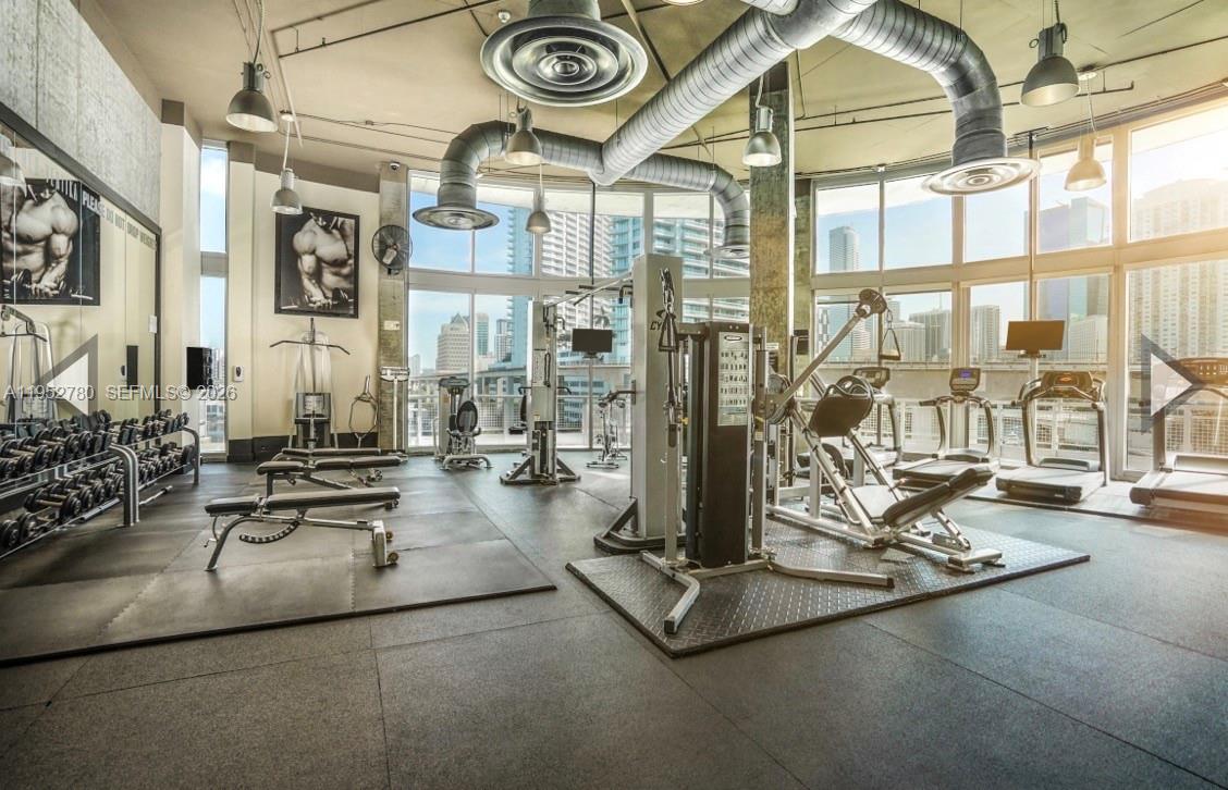 690 Southwest 1st Court, Unit 2524 Miami, FL 33130 - Photo 13 of 16 a view of a room with gym equipment